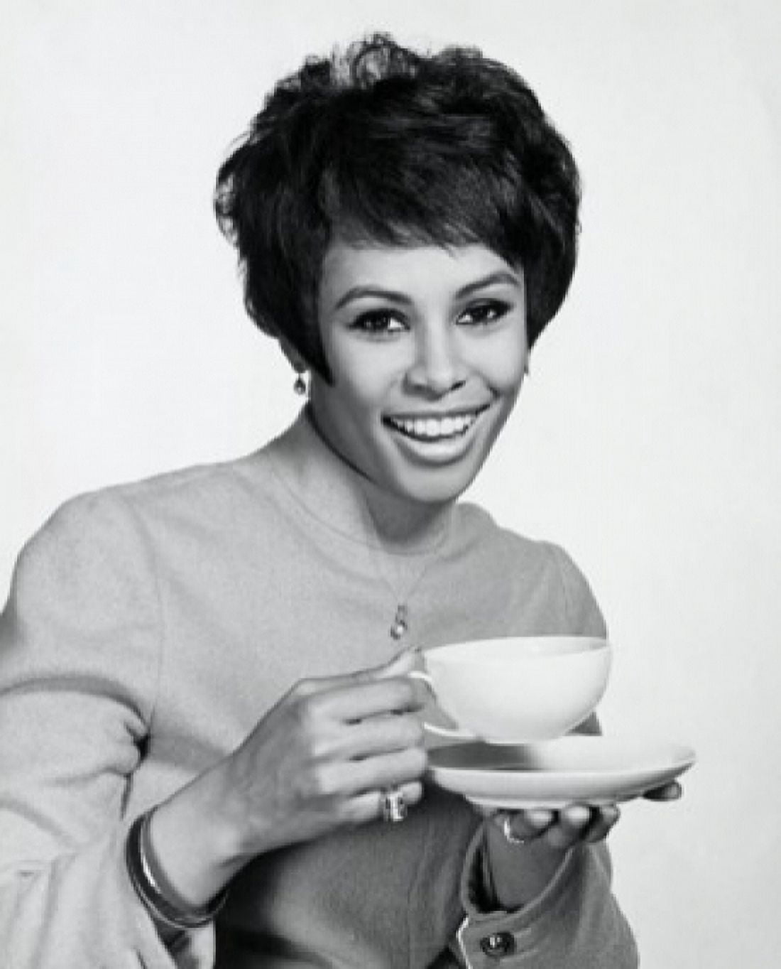 Portrait of a young woman holding a tea cup Canvas Art - (24 x 36)