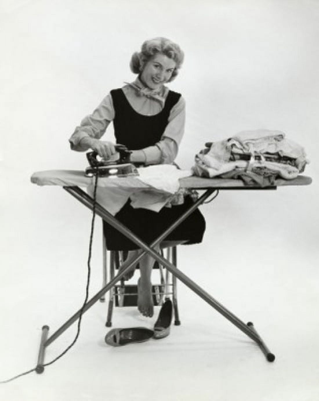 Portrait of a young woman ironing clothes Canvas Art - (18 x 24)