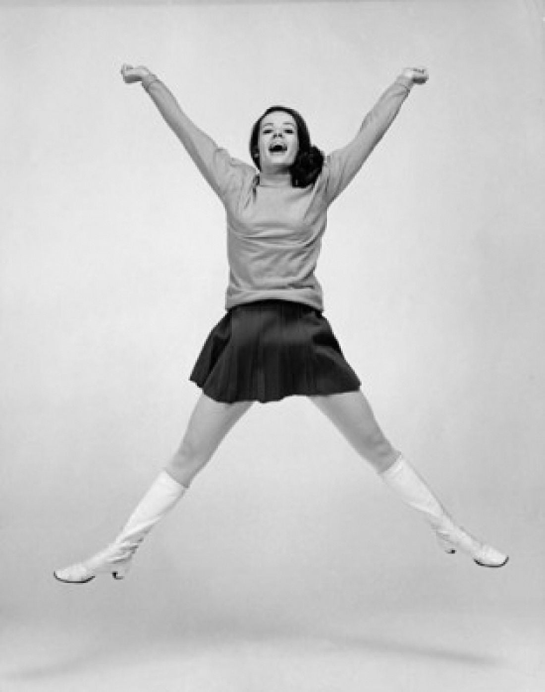 Portrait of a young woman jumping with her arms raised Canvas Art - (18 x 24)