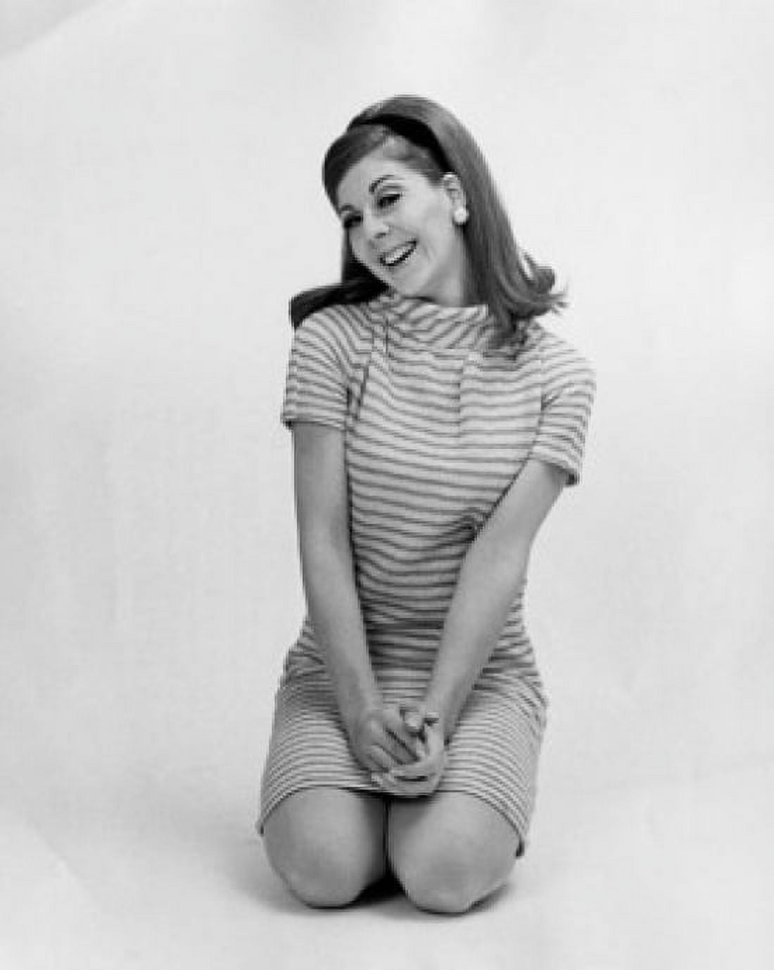 Portrait of a young woman kneeling on the floor and smiling Canvas Art - (18 x 24)