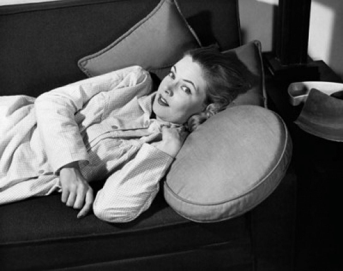 Portrait of a young woman lying on a couch Canvas Art - (24 x 36)
