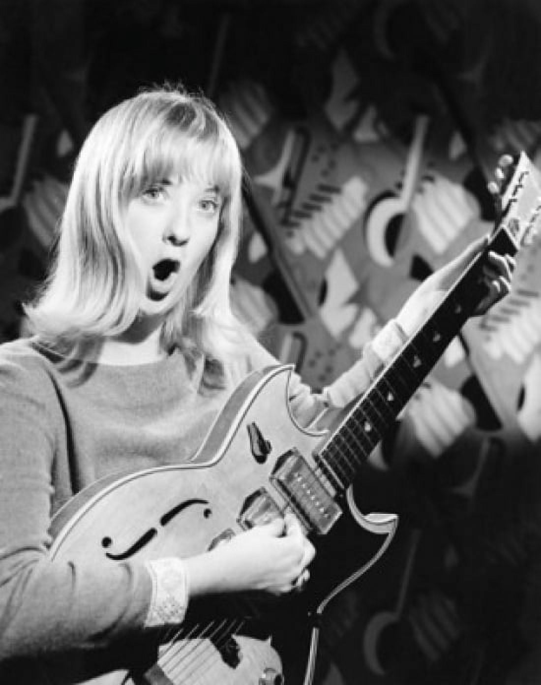 Portrait of a young woman playing an electric guitar and singing Canvas Art - (24 x 36)
