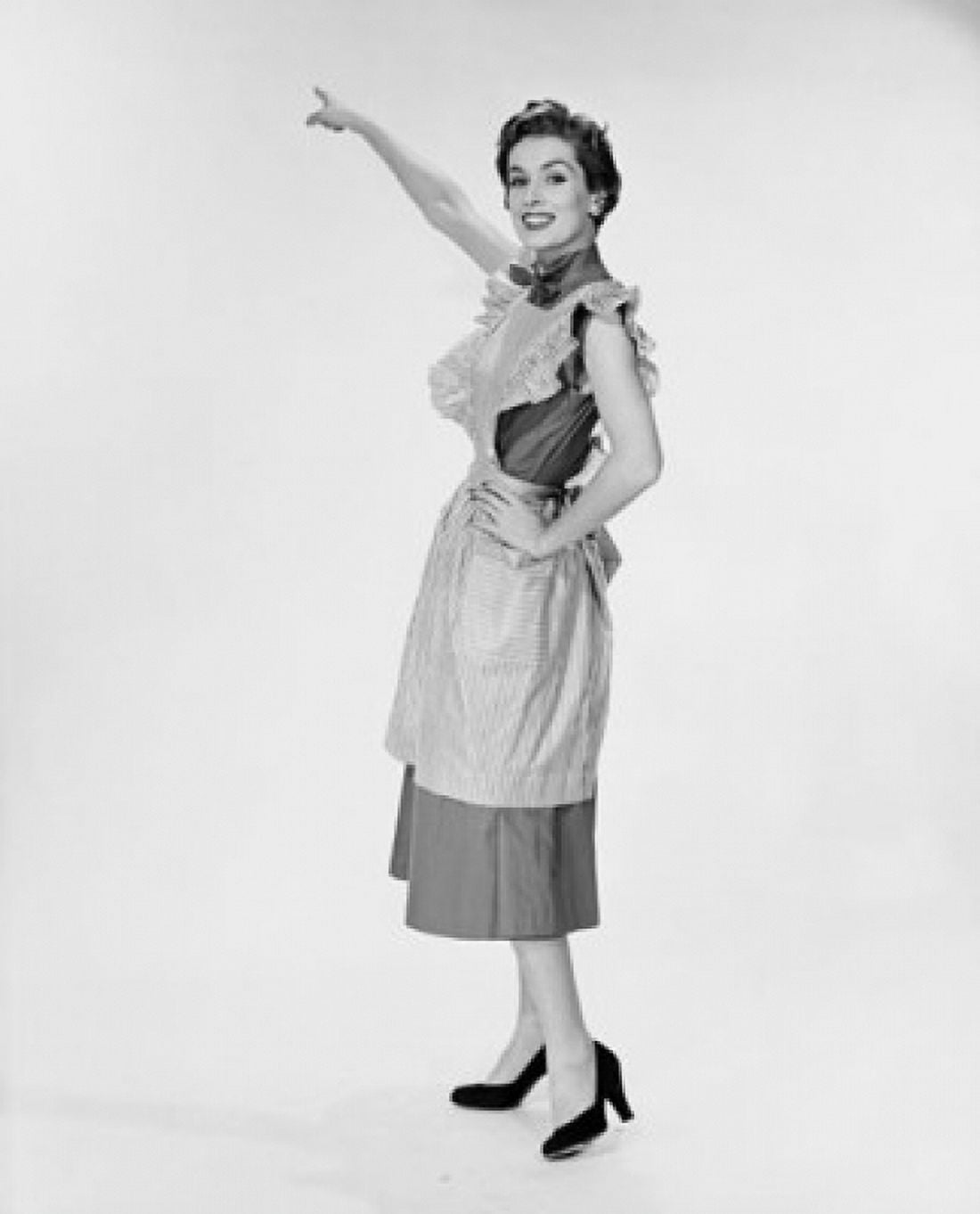 Portrait of a young woman pointing upwards Canvas Art - (18 x 24)