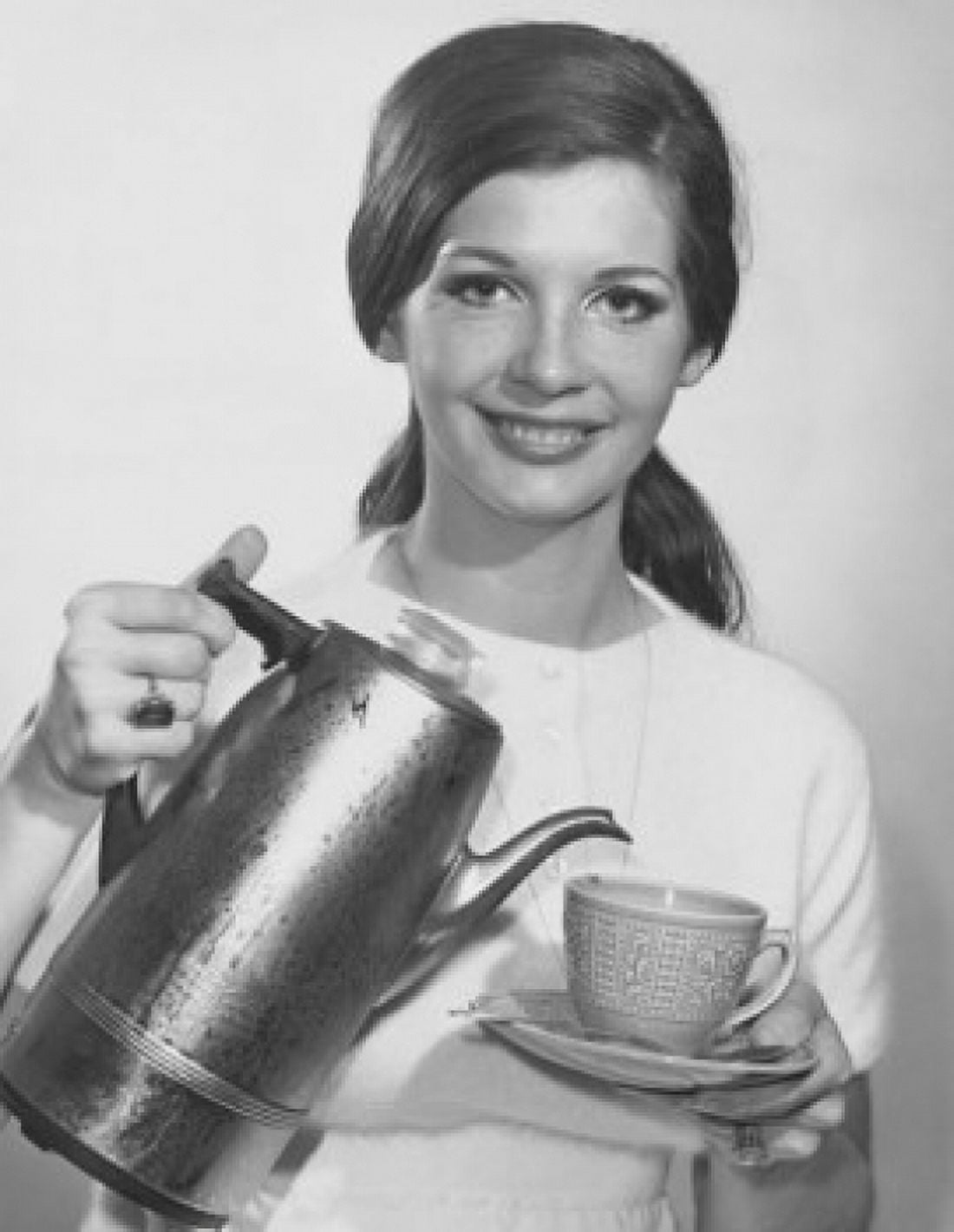 Portrait of a young woman pouring tea from a kettle Canvas Art - (18 x 24)