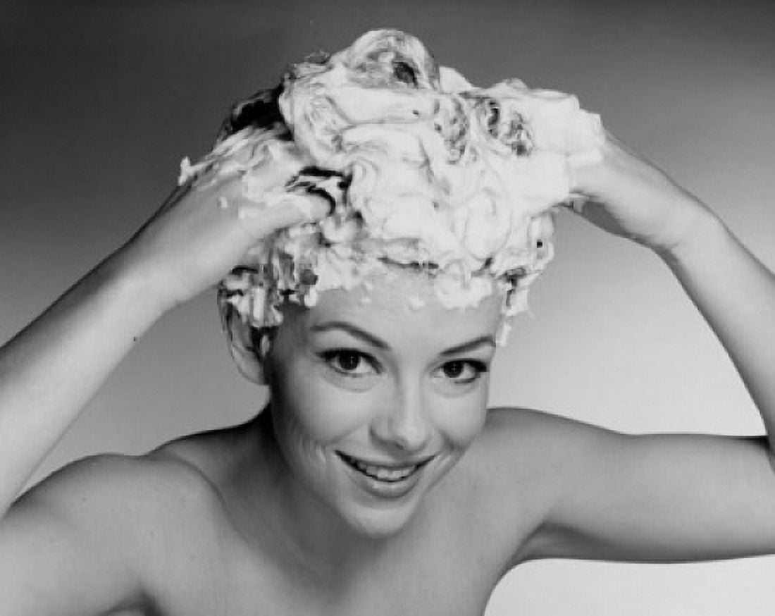 Portrait of a young woman shampooing her hair Canvas Art - (18 x 24)