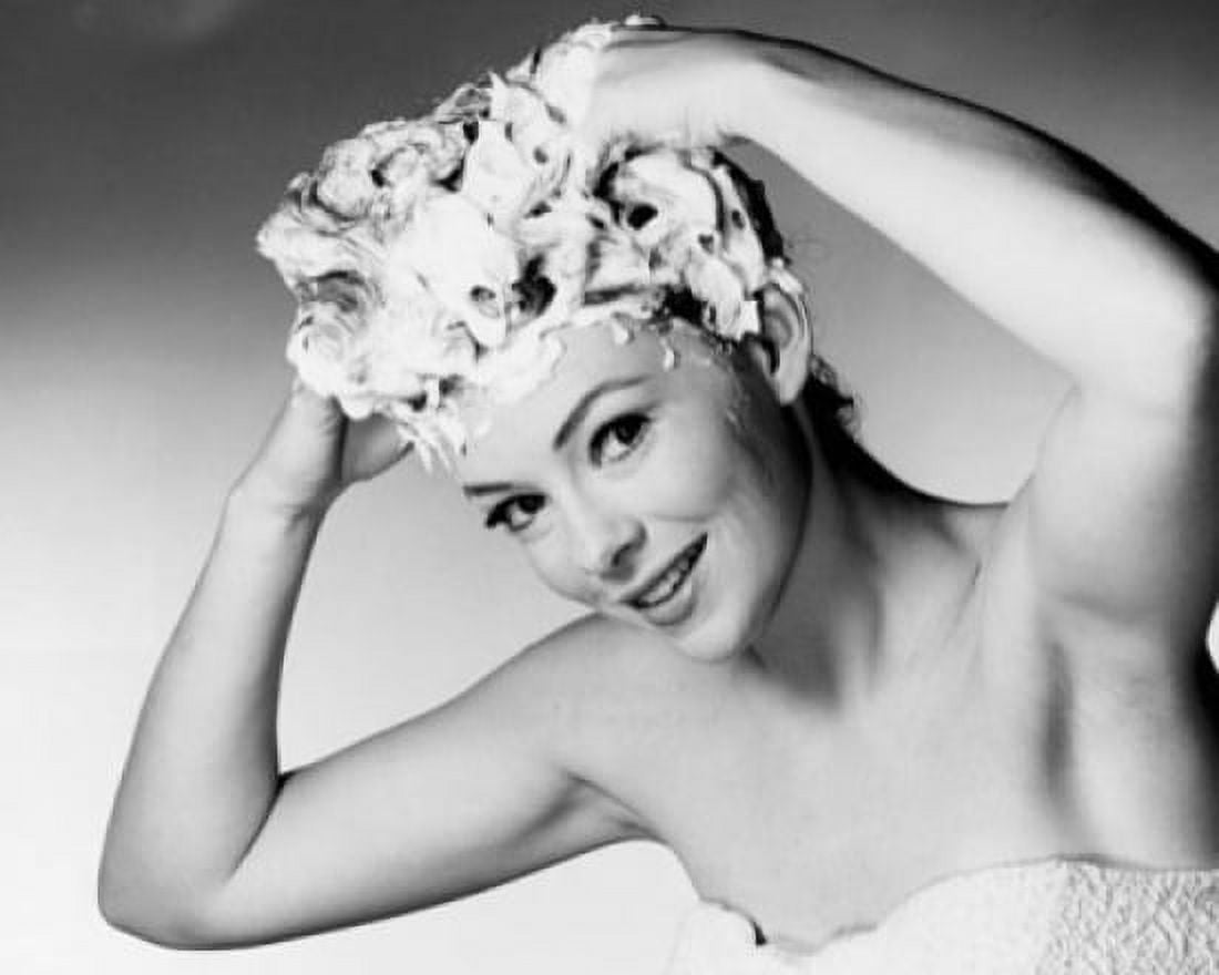 Portrait of a young woman shampooing her hair Canvas Art - (24 x 36)