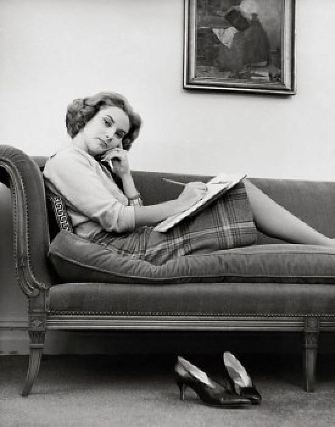 Portrait of a young woman sitting on a chaise longue Canvas Art - (18 x 24)