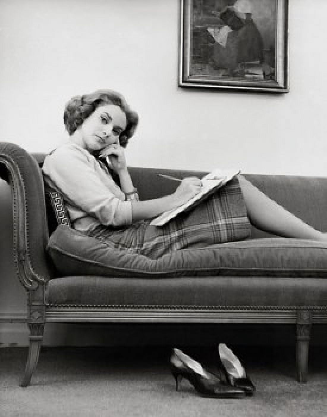 Portrait of a young woman sitting on a chaise longue Canvas Art - (24 x 36)