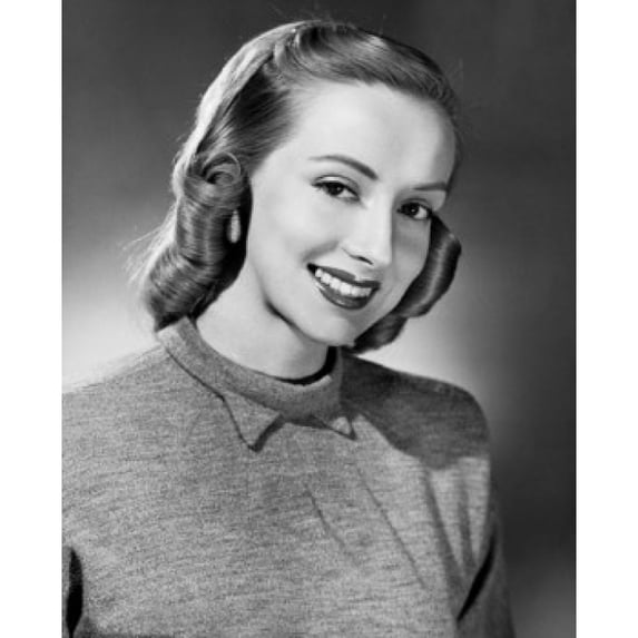 Portrait of a young woman smiling Poster Print (18 x 24)
