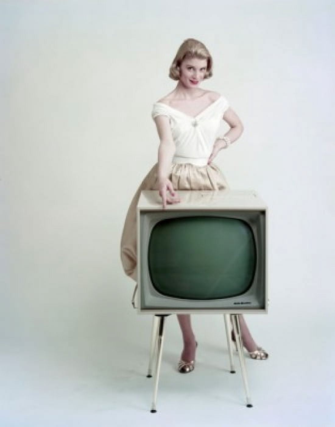 Portrait of a young woman standing behind a television and smiling Canvas Art - (18 x 24)