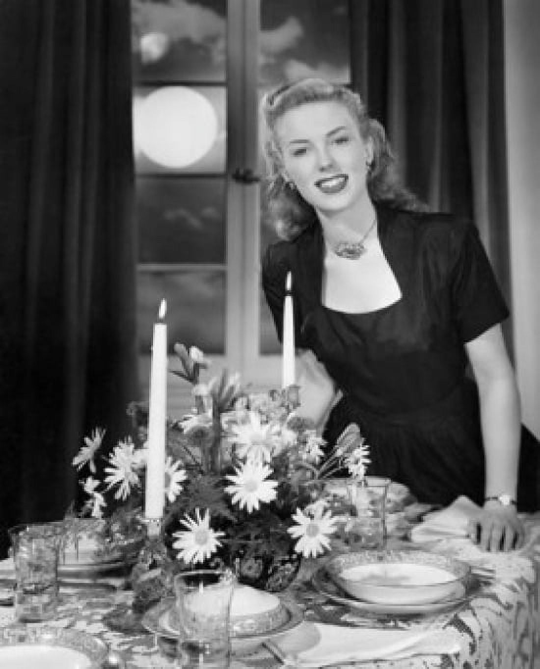Portrait of a young woman standing near a dining table Canvas Art - (24 x 36)