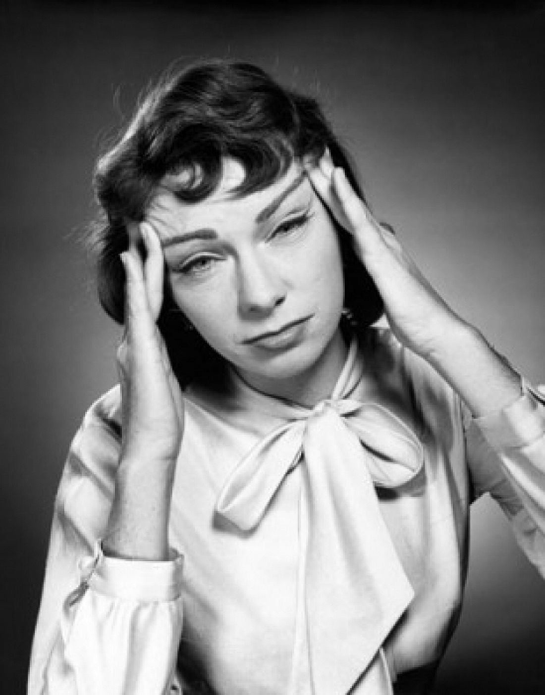 Portrait of a young woman suffering from a headache Canvas Art - (24 x 36)