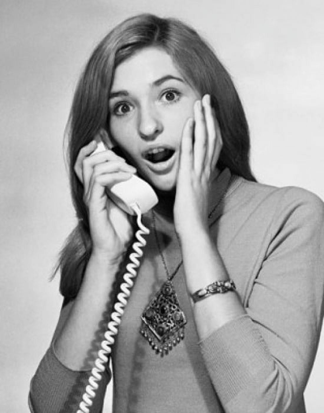 Portrait of a young woman talking on the telephone and looking surprised Canvas Art - (18 x 24)