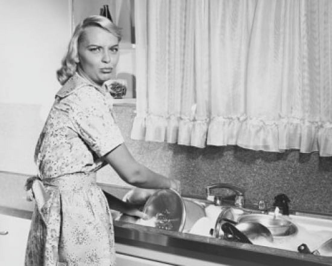 Portrait of a young woman washing pots and pans in a kitchen Canvas Art - (24 x 36)