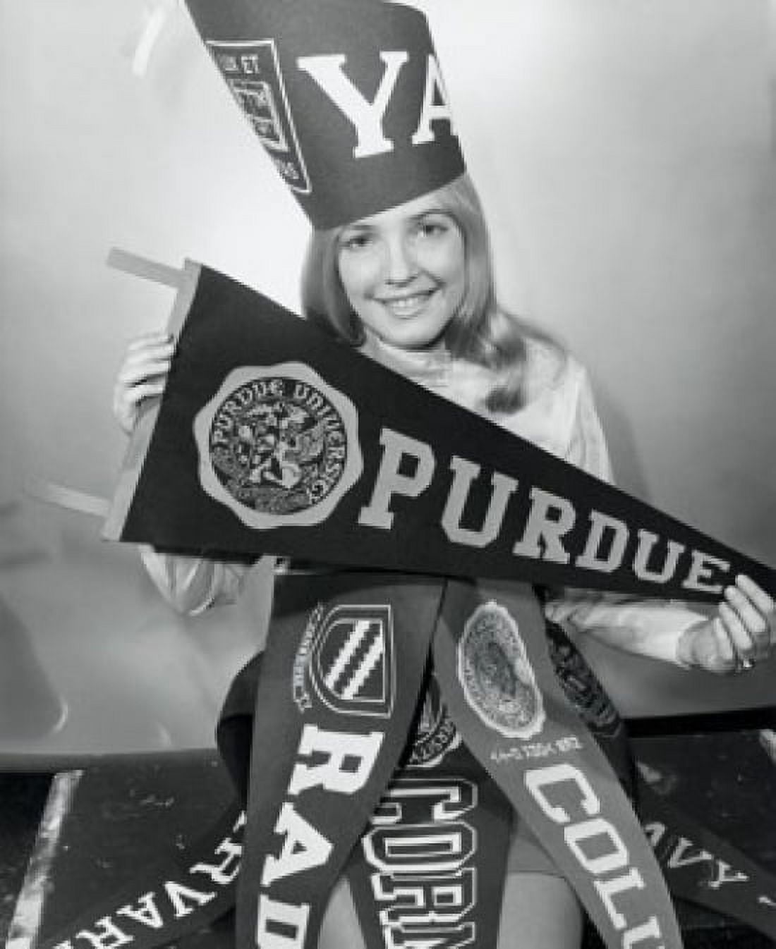 Portrait of a young woman with college penants Canvas Art - (24 x 36)