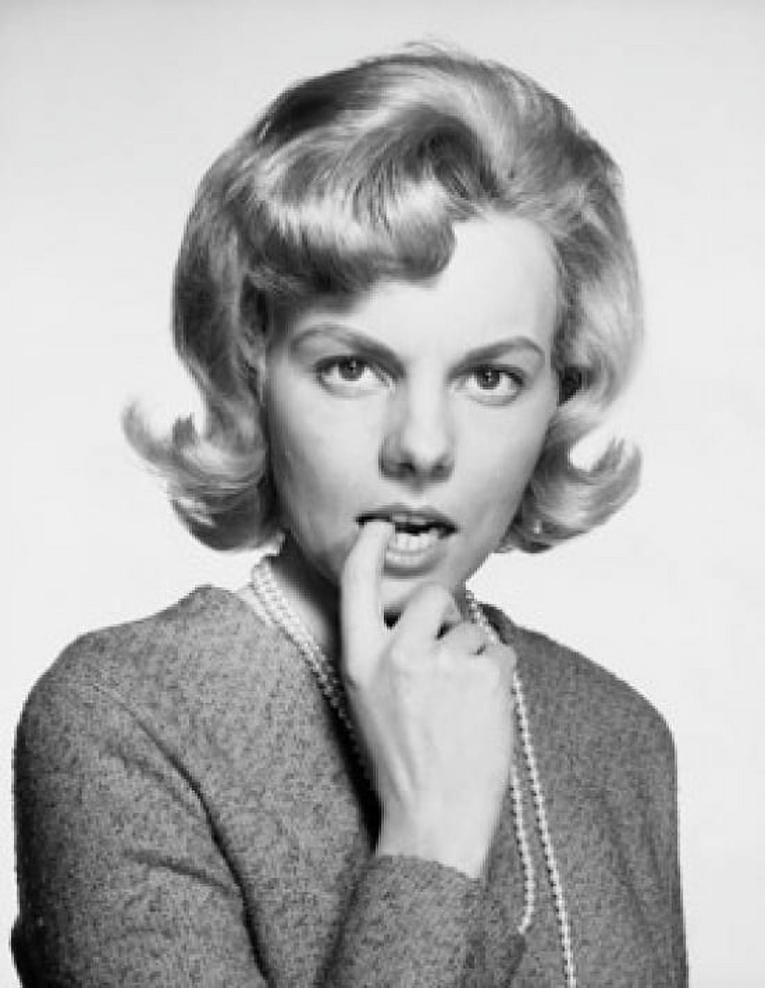 Portrait of a young woman with her finger in her mouth Canvas Art - (18 x 24)