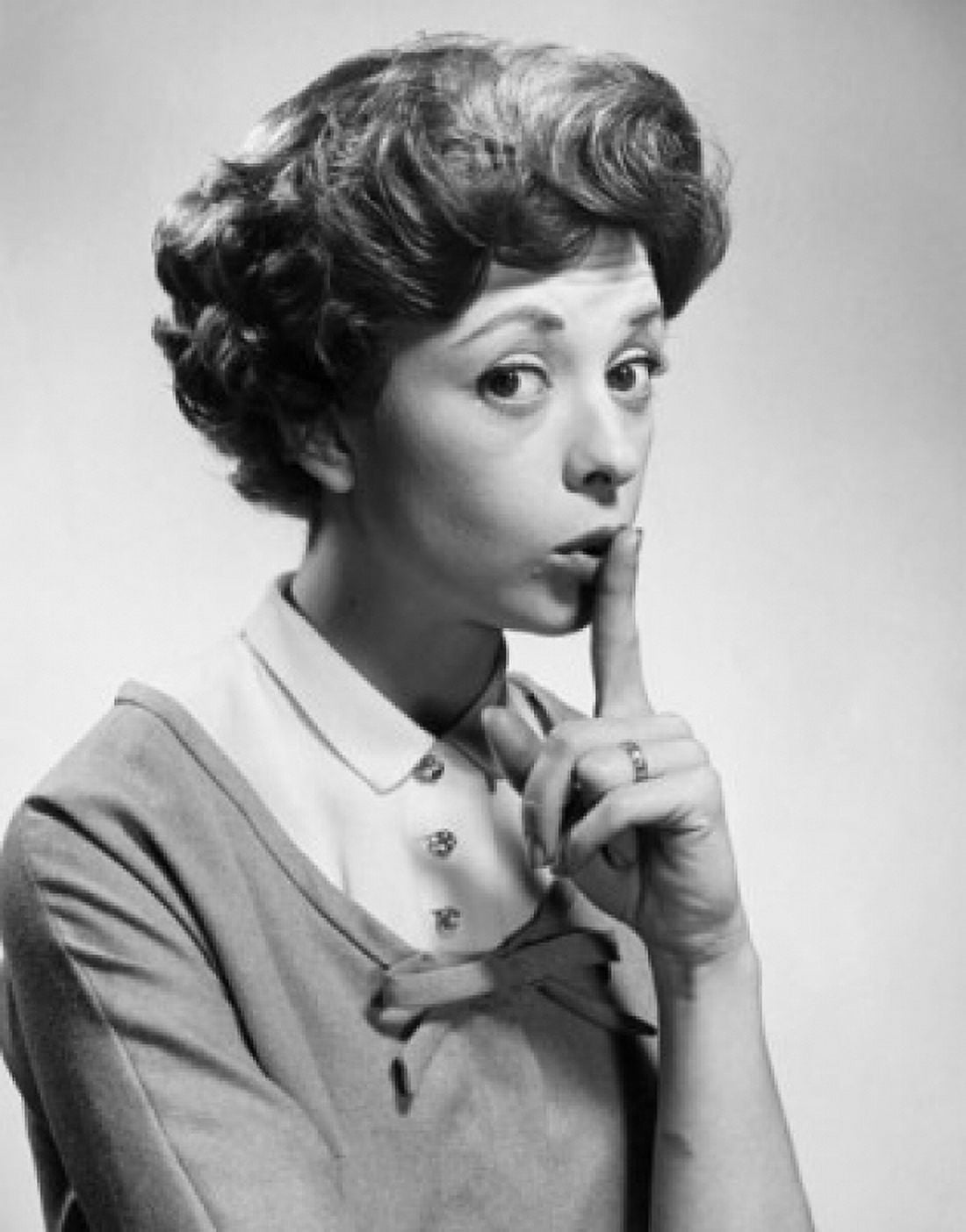 Portrait of a young woman with her finger on her lips Canvas Art - (24 x 36)