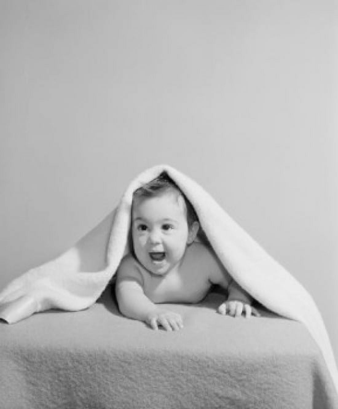 Portrait of baby boy lying under cover on bed Canvas Art - (18 x 24)