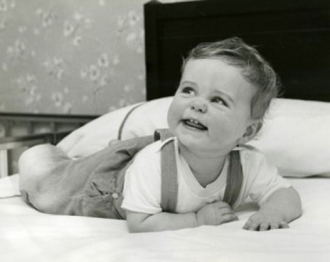 Portrait of baby lying on bed Canvas Art - (18 x 24)