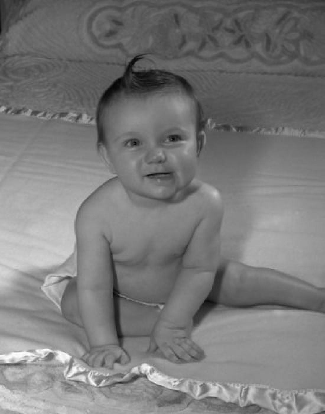 Portrait of baby sitting on bed Canvas Art - (18 x 24)