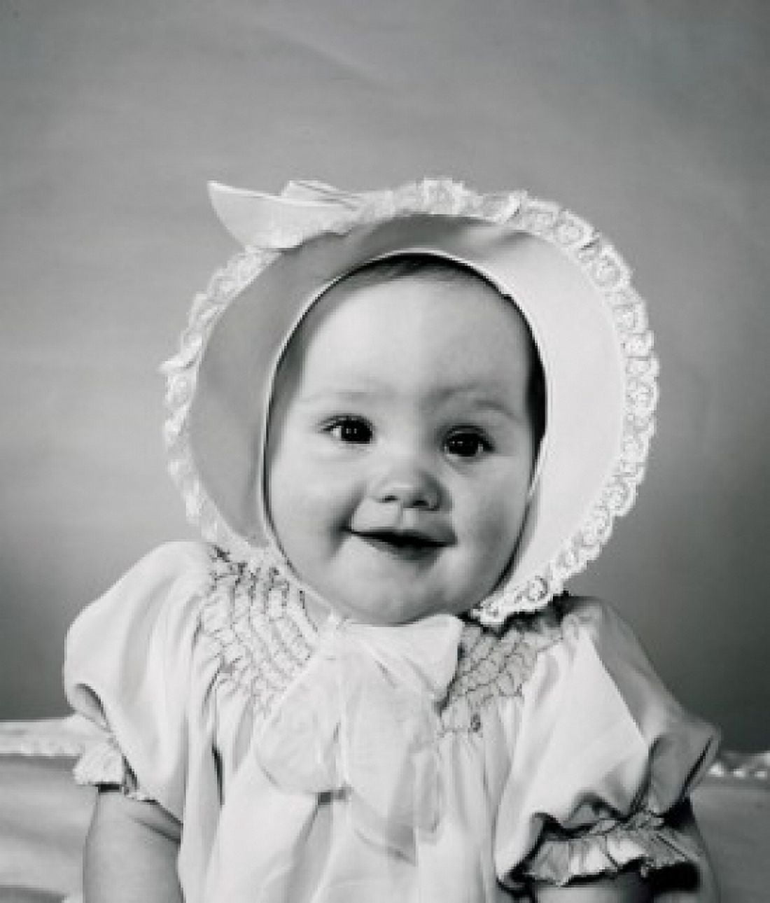 Portrait of baby wearing bonnet Canvas Art - (18 x 24)