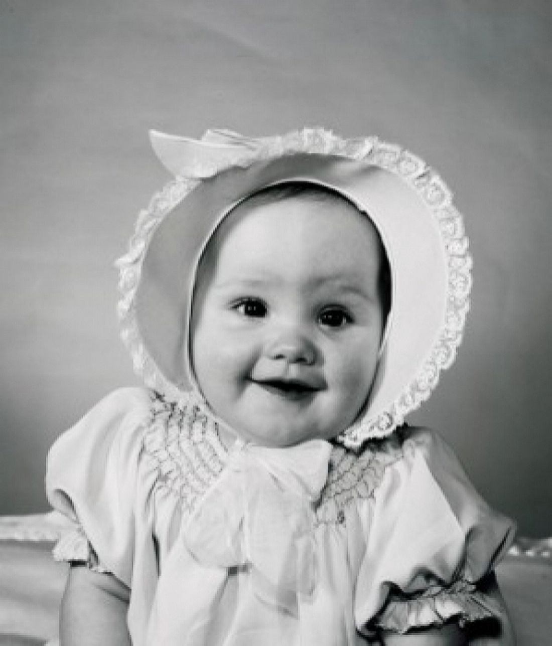 Portrait of baby wearing bonnet Canvas Art - (24 x 36)