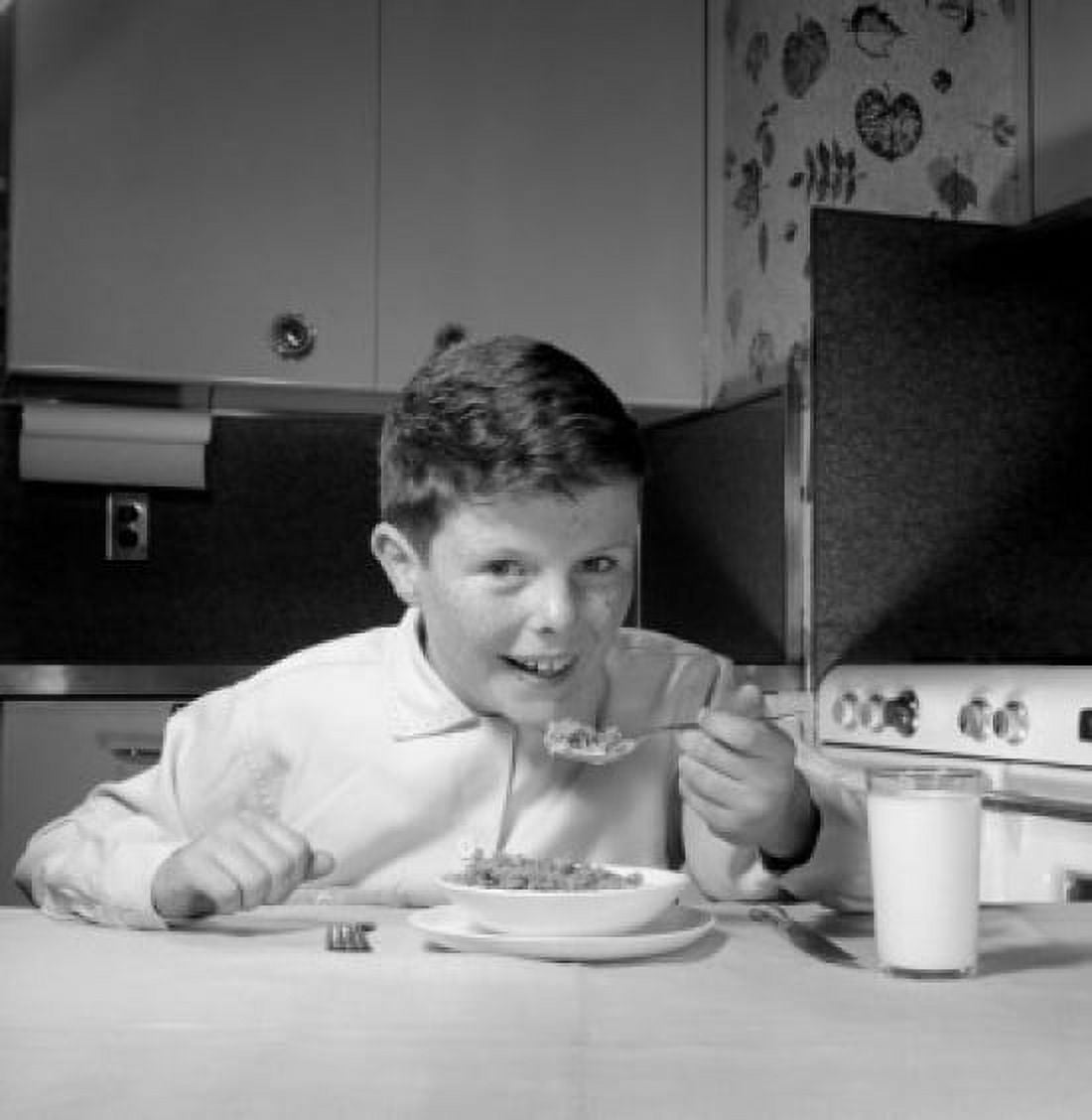 Portrait of boy eating Canvas Art - (24 x 36)