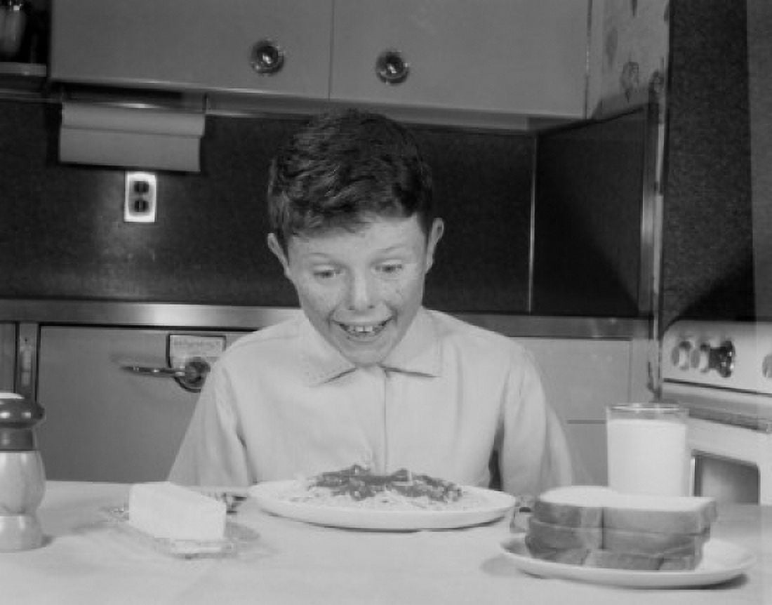Portrait of boy eating spaghetti Canvas Art - (24 x 36)