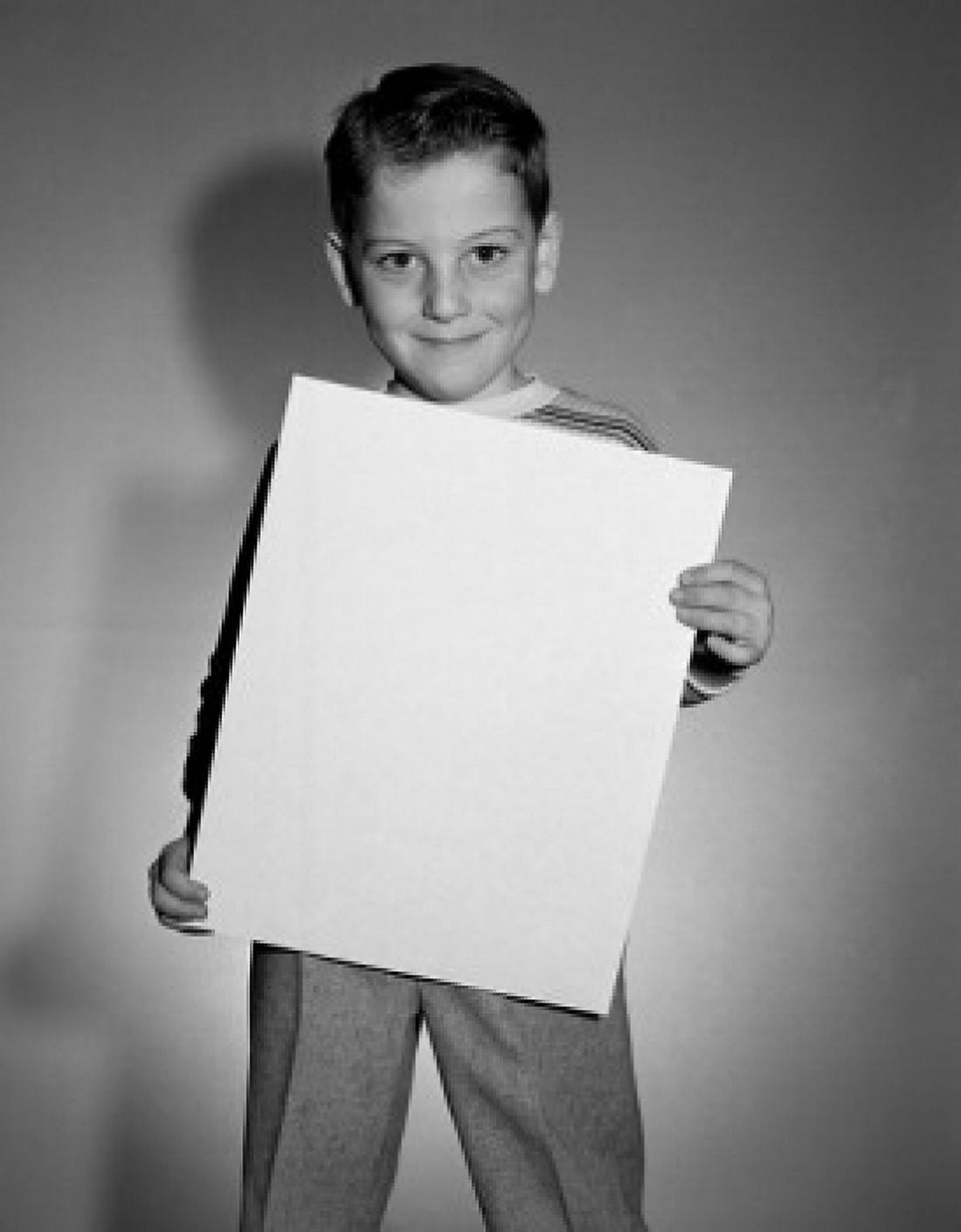 Portrait of boy holding document Canvas Art - (24 x 36)