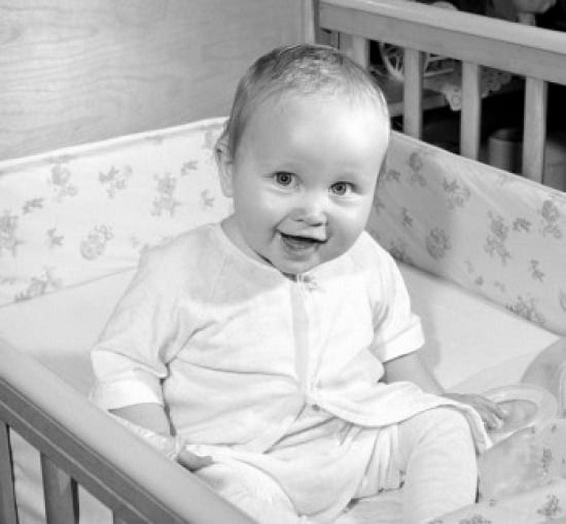 Portrait of cheerful baby sitting in cot Canvas Art - (24 x 36)