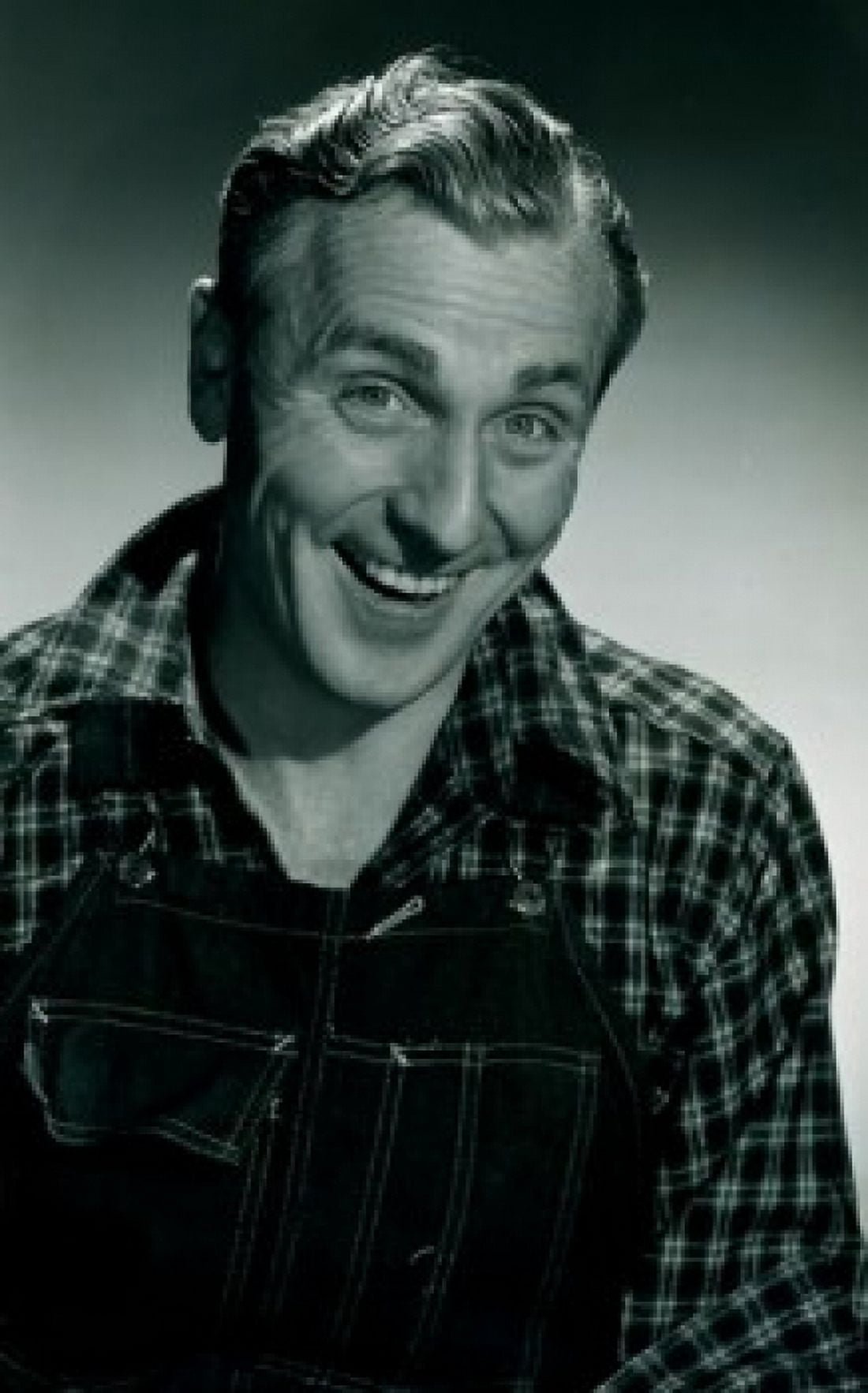 Portrait of cheerful mature man wearing lumberjack shirt and overalls Canvas Art - (18 x 24)