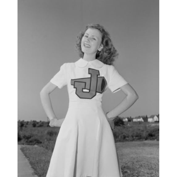 Portrait of cheerleader smiling Poster Print (24 x 36)