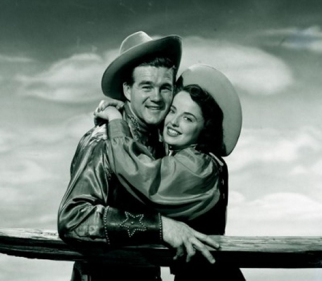 Portrait of cowboy embracing cowgirl Canvas Art - (24 x 36)