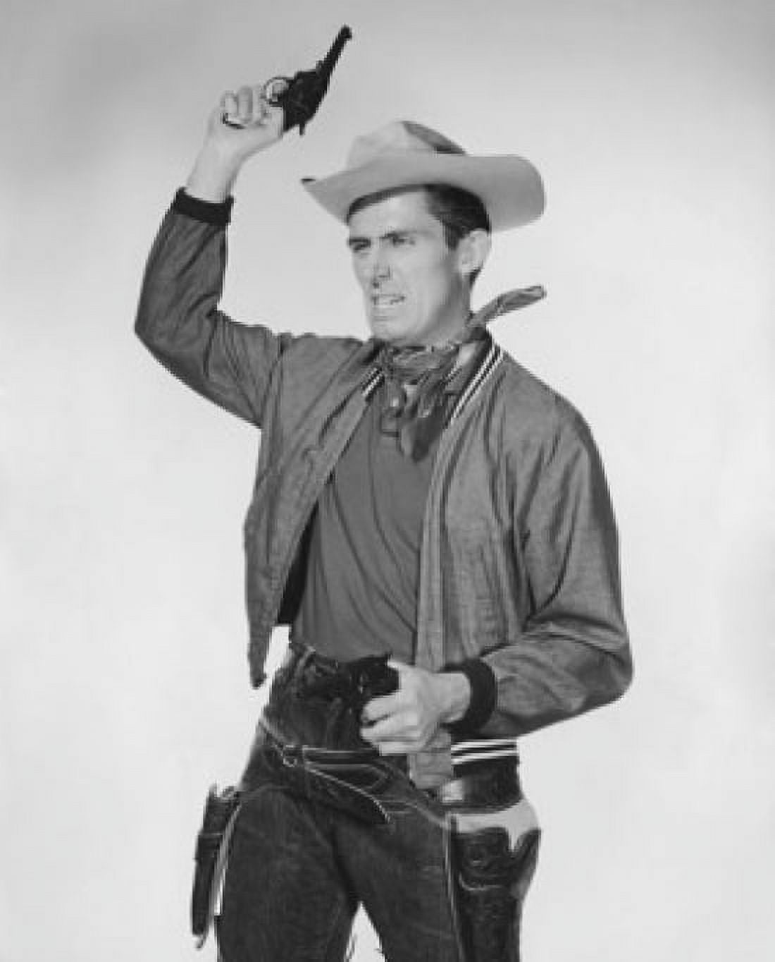 Portrait of cowboy shooting into the air and pointing handgun Canvas Art - (24 x 36)