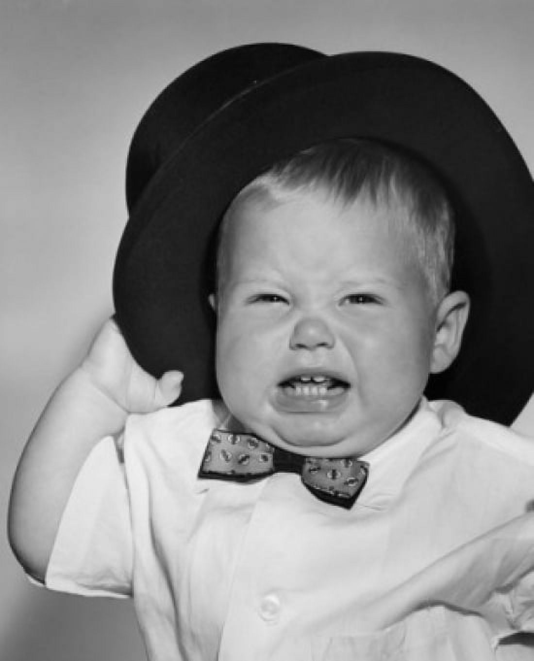 Portrait of crying baby boy in black hat Canvas Art - (24 x 36)
