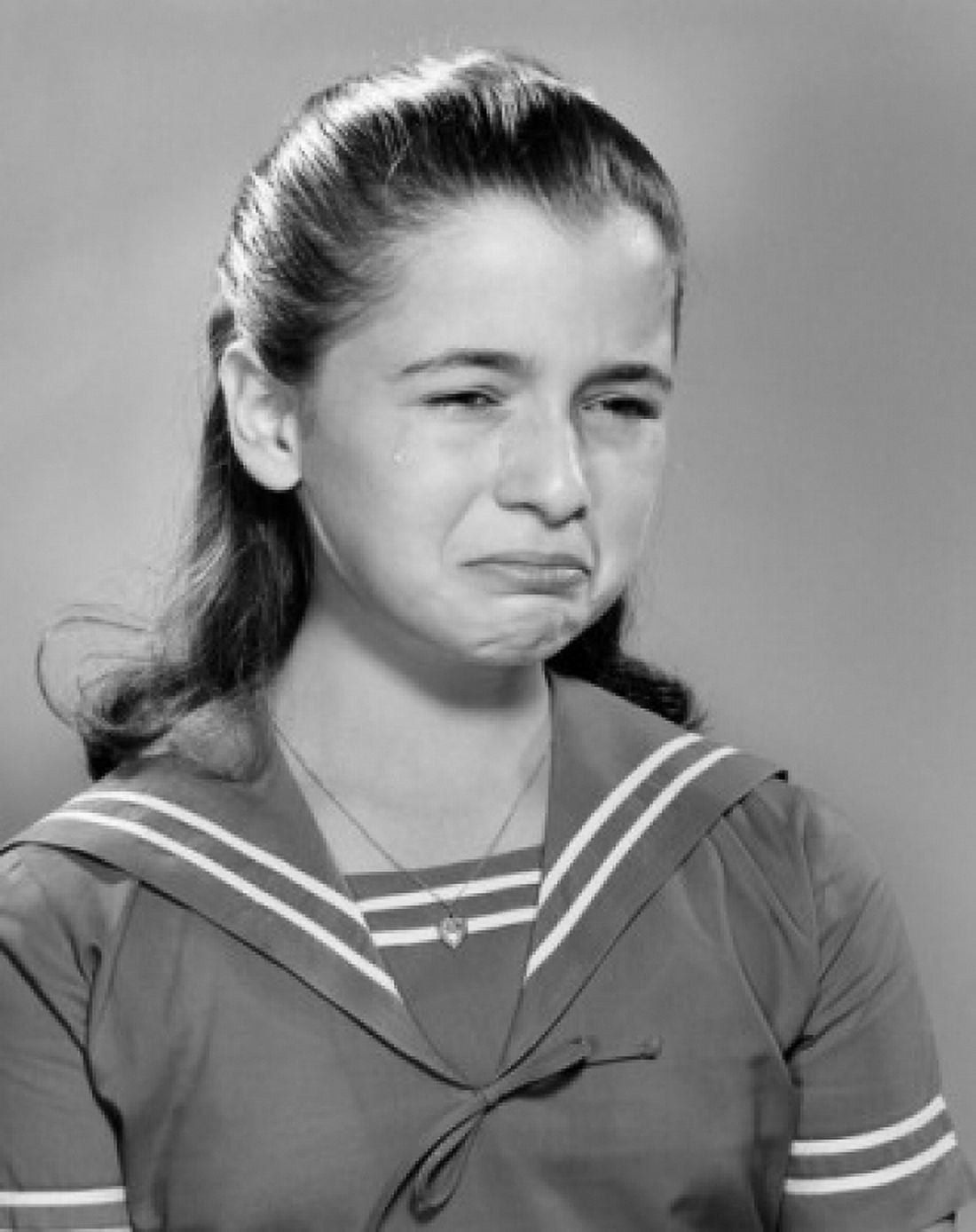 Portrait of crying girl in sailor blouse Canvas Art - (24 x 36)