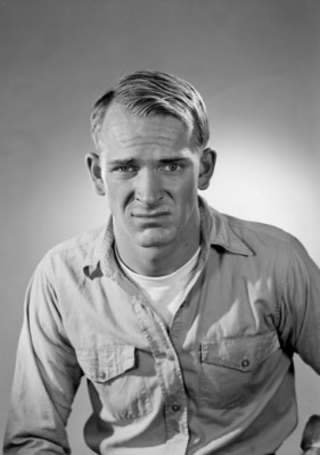 Portrait of displeased young man looking at camera studio shot Canvas Art - (24 x 36)