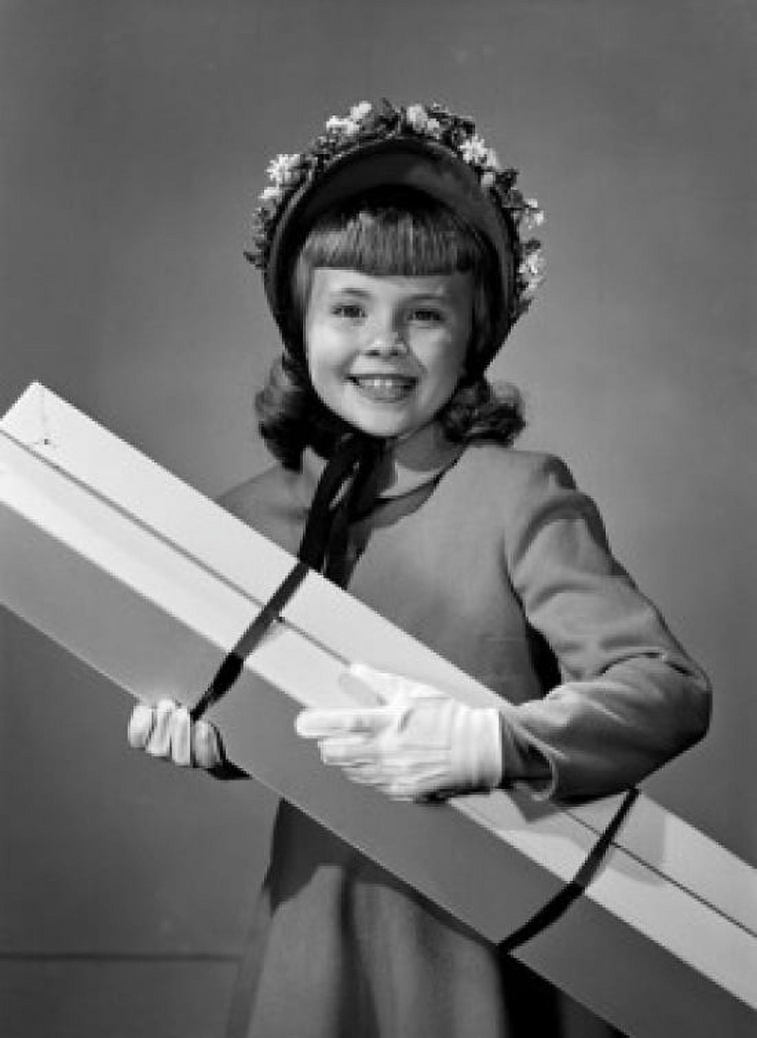 Portrait of elegant girl carrying large box Canvas Art - (24 x 36)