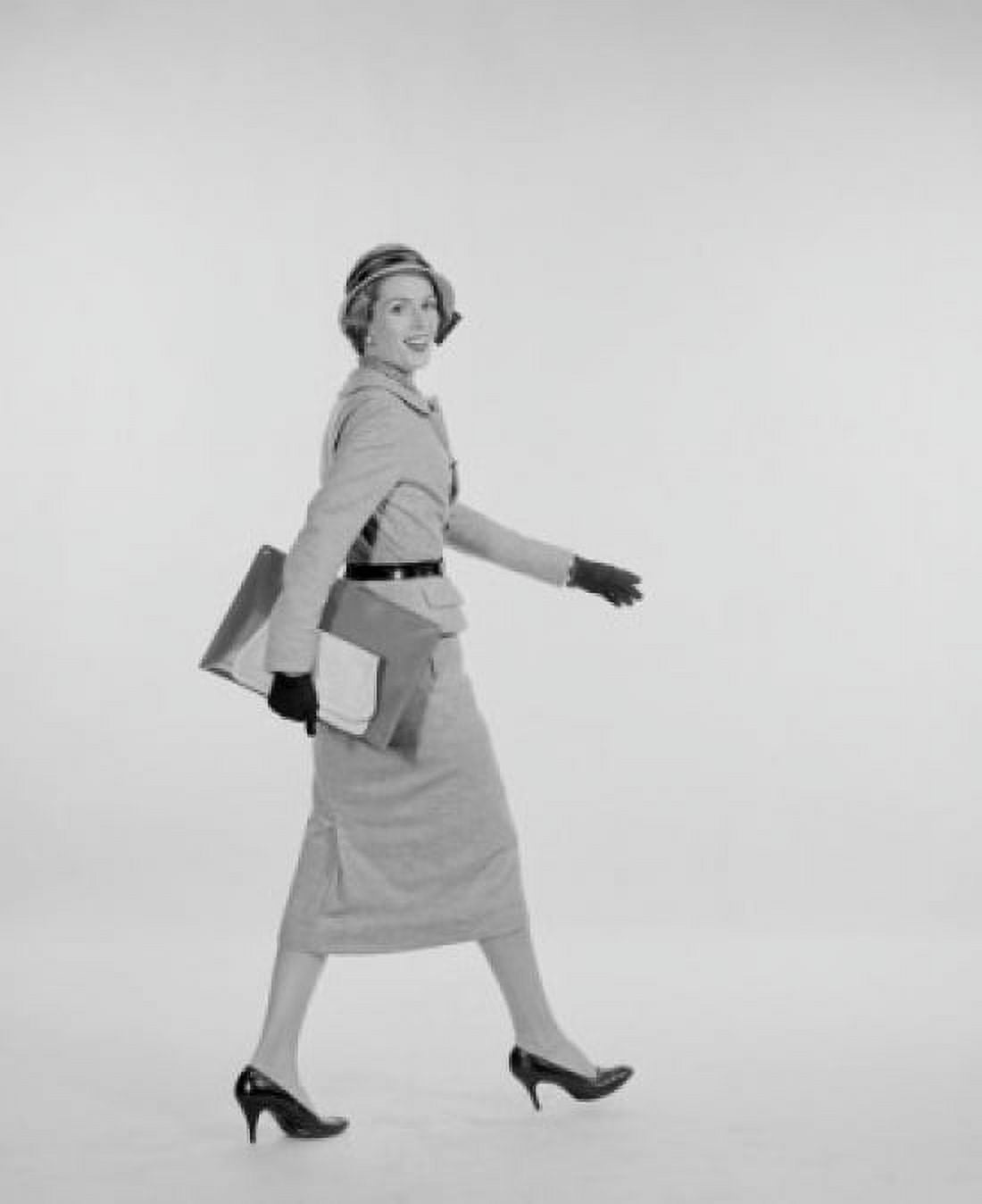 Portrait of elegant young woman walking studio shot Canvas Art - (18 x 24)