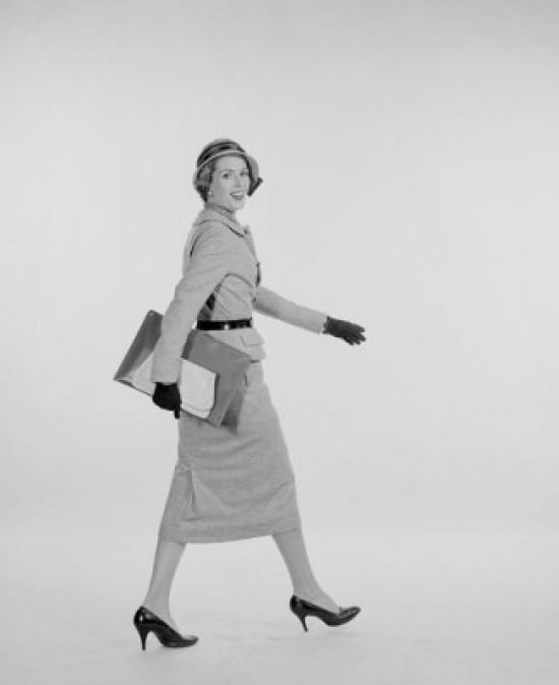 Portrait of elegant young woman walking studio shot Canvas Art - (24 x 36)
