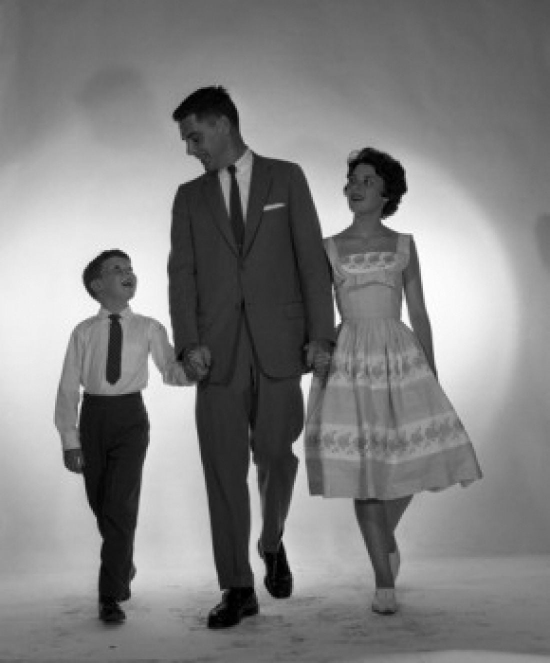Portrait of family with one son walking arm in arm Canvas Art - (24 x 36)