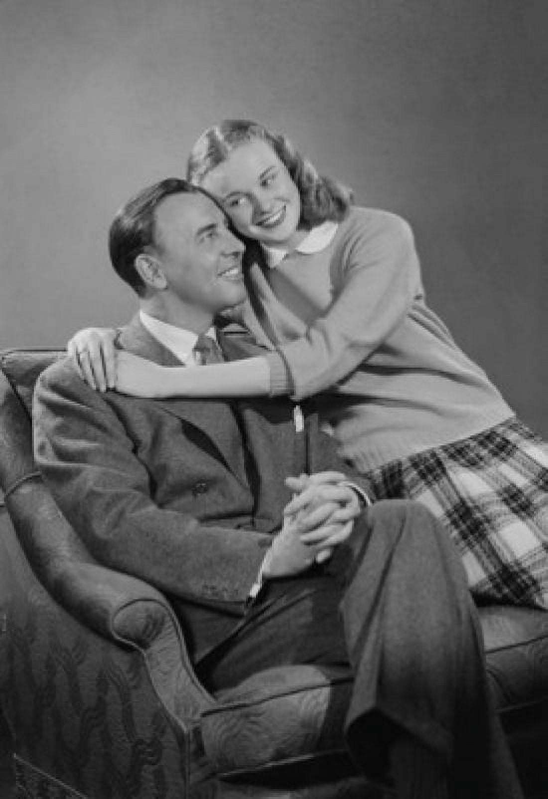 Portrait of father and daughter on armchair Canvas Art - (24 x 36)