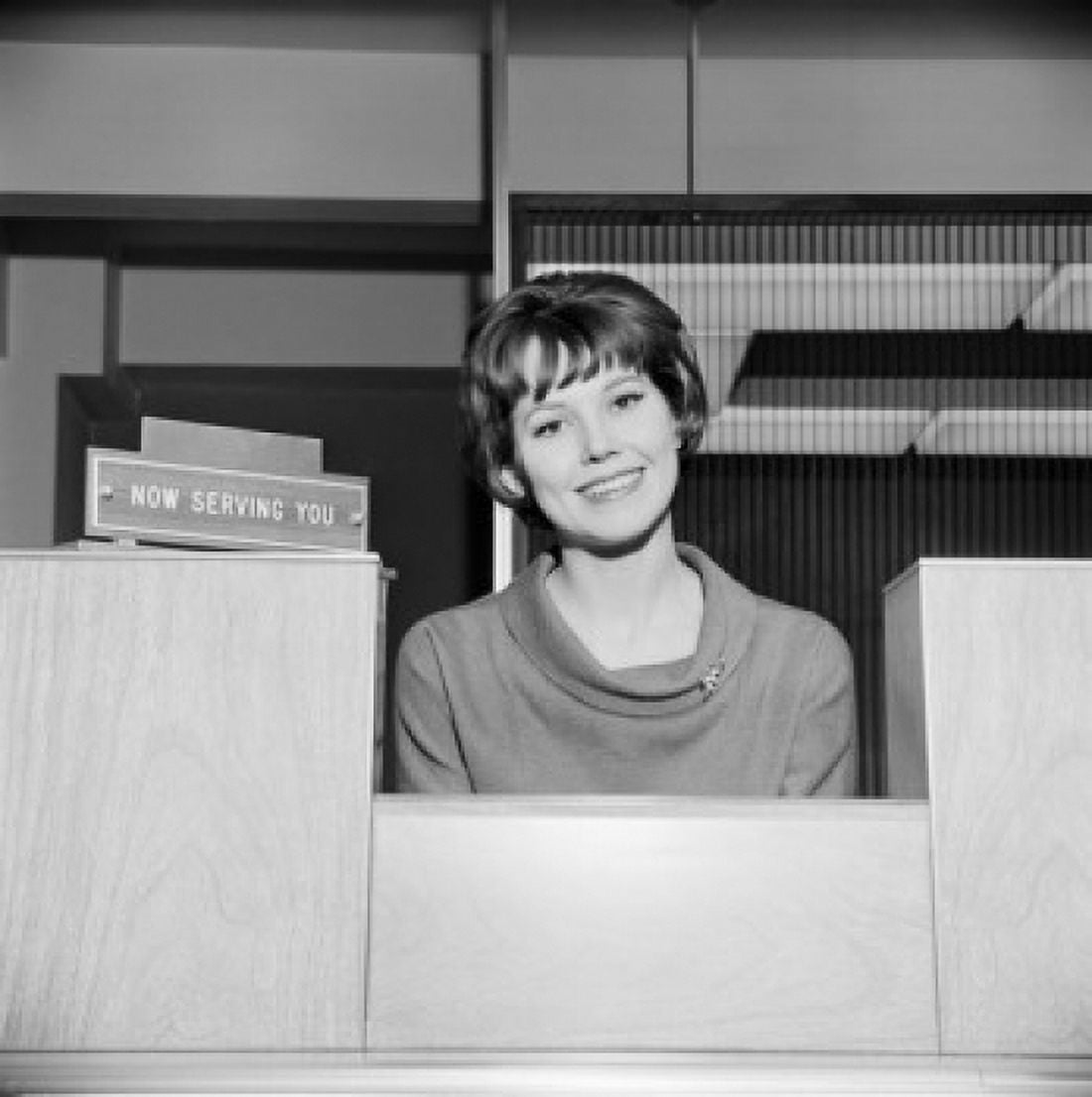 Portrait of female attendant behind counter Canvas Art - (18 x 24)