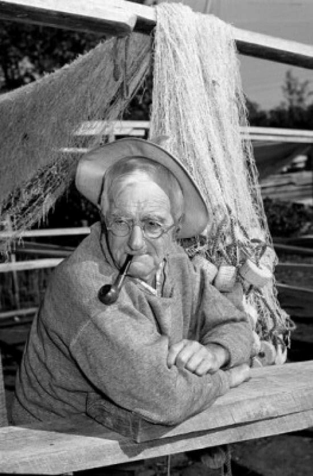 Portrait of fisherman with pipe fishing net in the background Canvas Art -  (18 x 24)