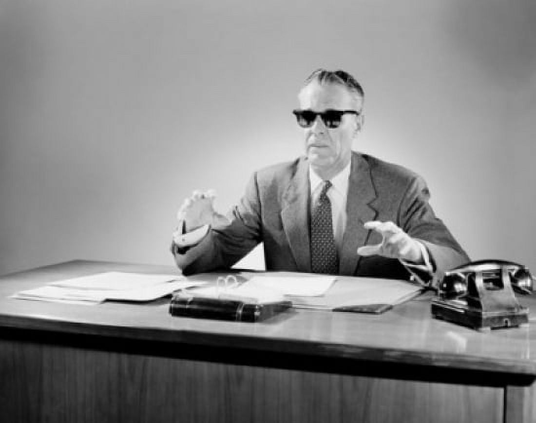 Portrait of gesturing senior businessman wearing sunglasses in the office Canvas Art - (18 x 24)