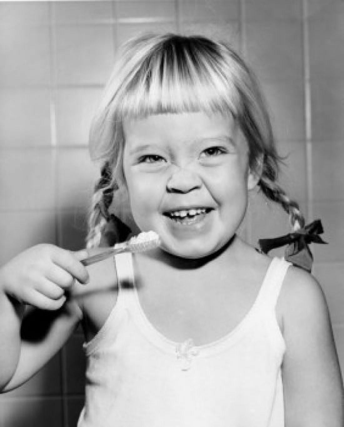 Portrait of girl brushing teeth Canvas Art - (24 x 36)