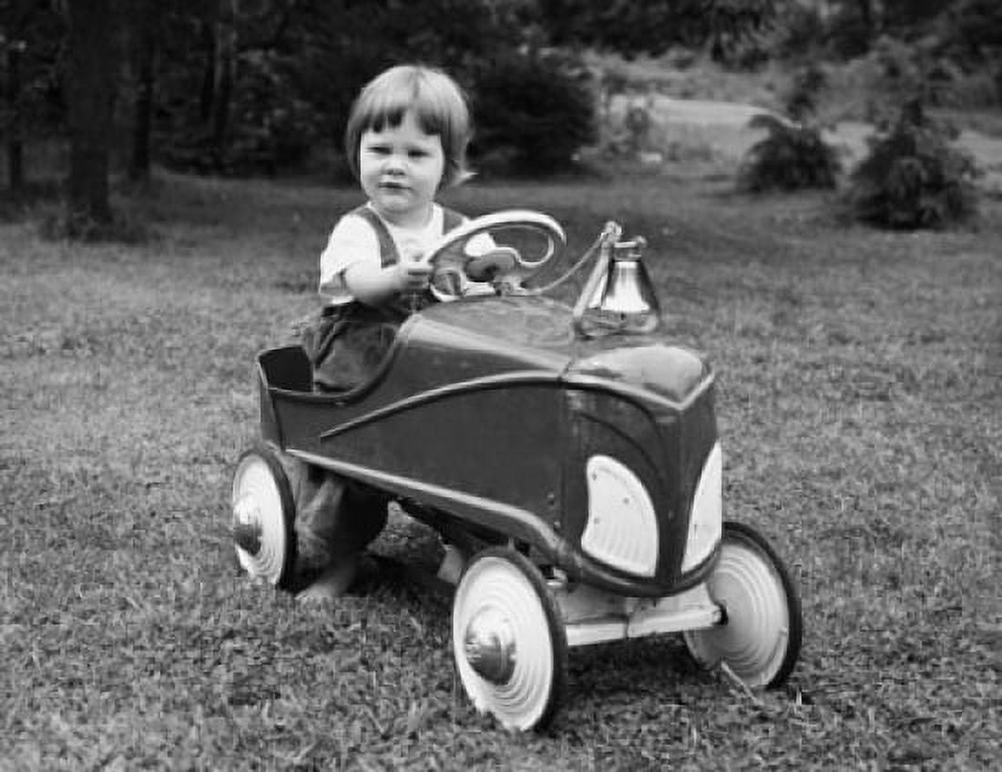 Portrait of girl driving toy car Canvas Art - (18 x 24)