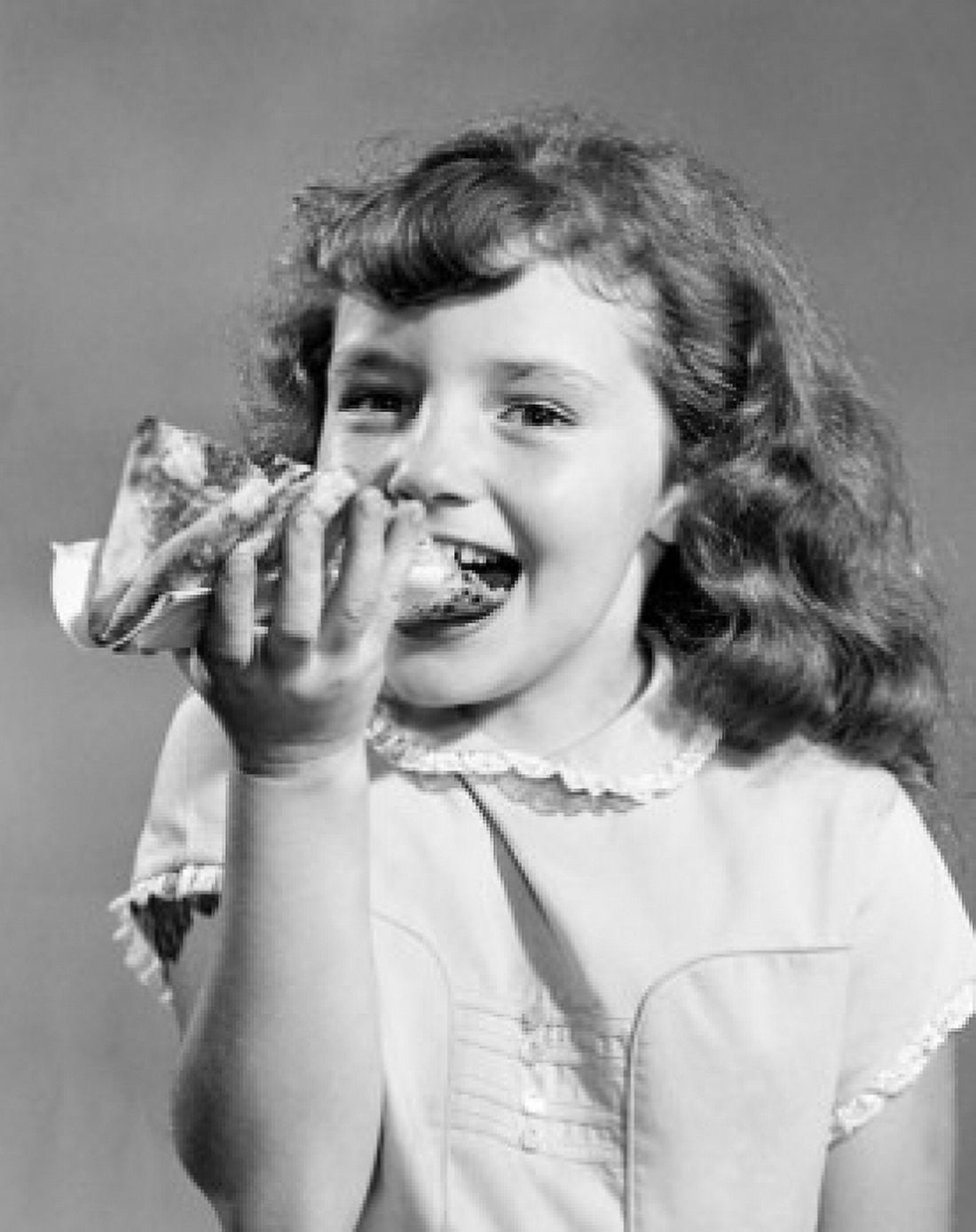 Portrait of girl eating slice of pizza Canvas Art - (18 x 24)