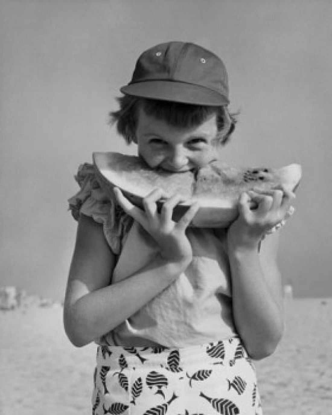 Portrait of girl eating watermelon on beach Canvas Art - (18 x 24)