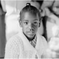 thumbnail image 1 of Portrait of girl looking at camera Poster Print (24 x 36), 1 of 4